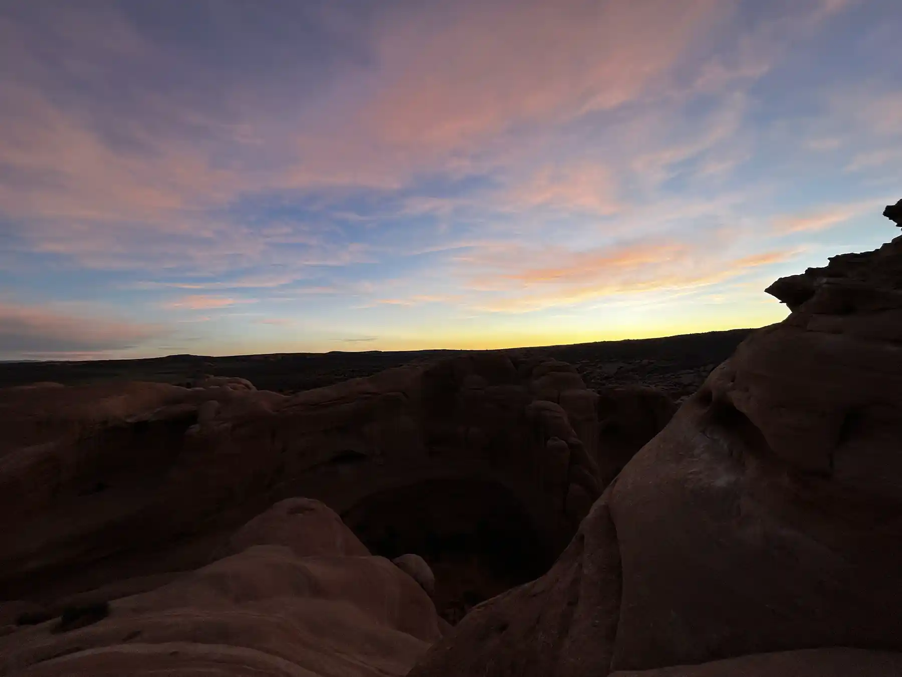 Desert hiking route through sandstone formations in Arches National Park