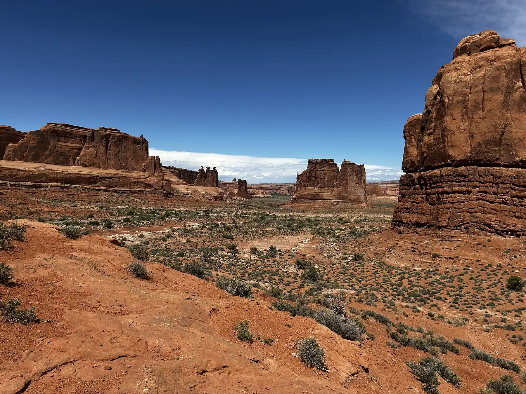 Desert hiking route through sandstone formations in Arches National Park
